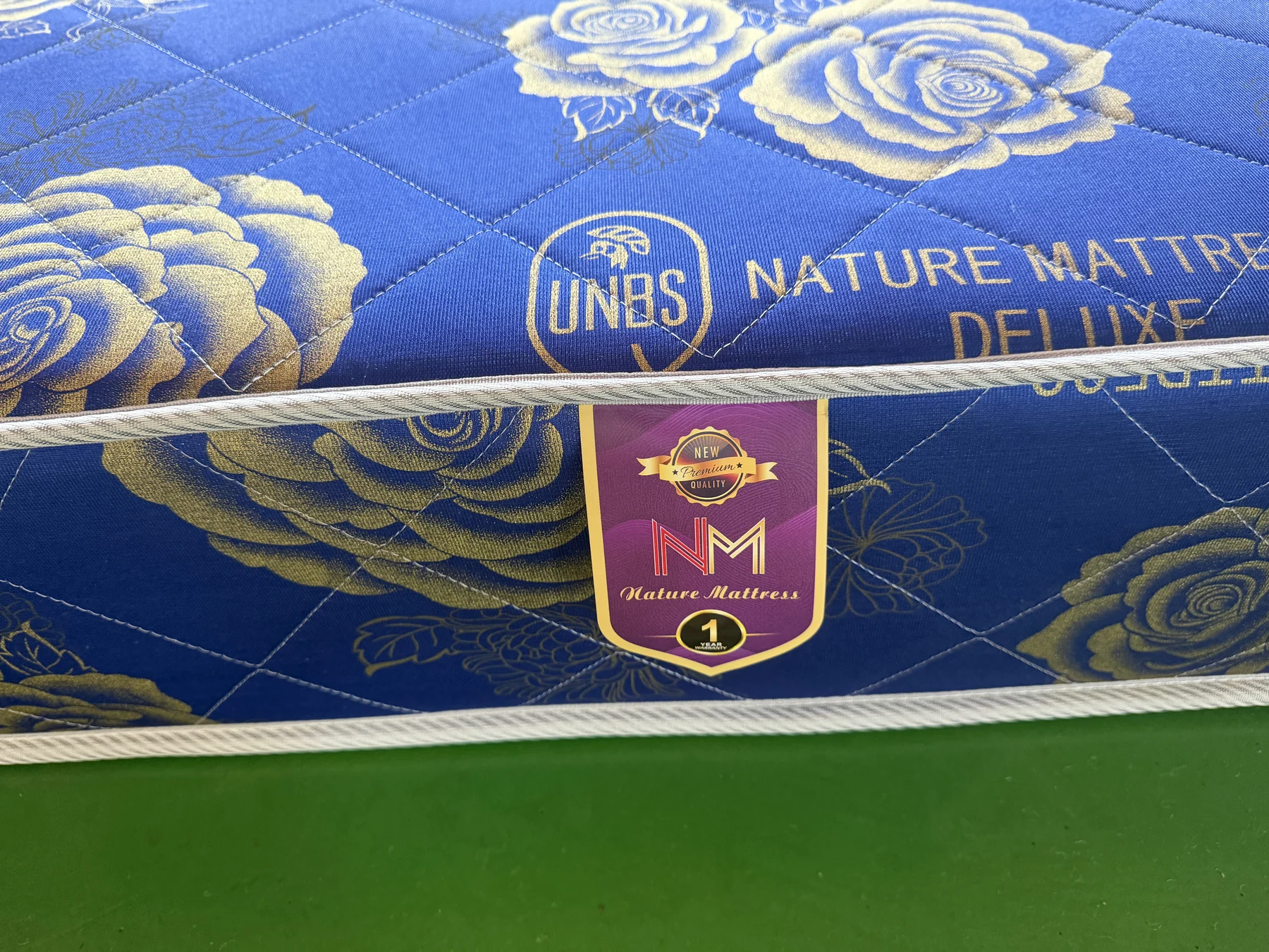 Nature Mattress quilting, UNBS mark and product label detail